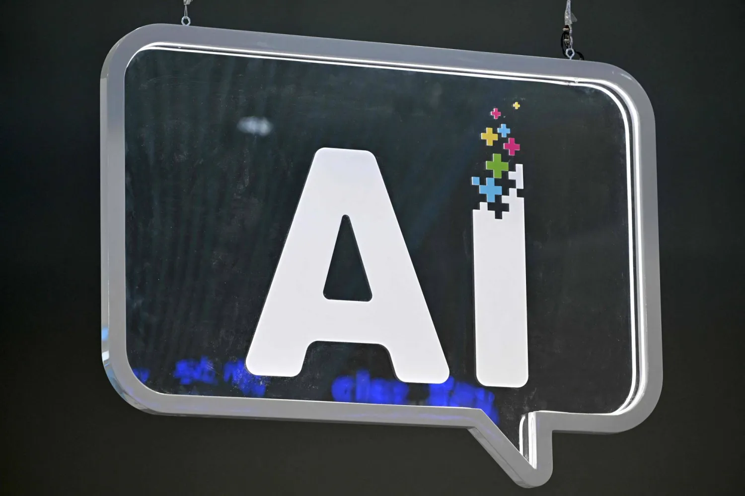 An AI (artificial intelligence) logo is pictured at the Mobile World Congress (MWC), the telecom industry's biggest annual gathering, in Barcelona on February 27, 2024. (AFP)