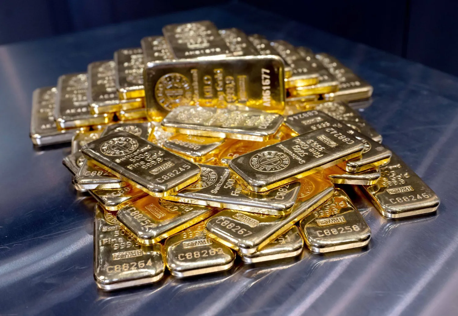 04 April 2025, Bavaria, Munich: Gold bars of various sizes lie in a safe on a table at the precious metal dealer Pro Aurum. (dpa)
