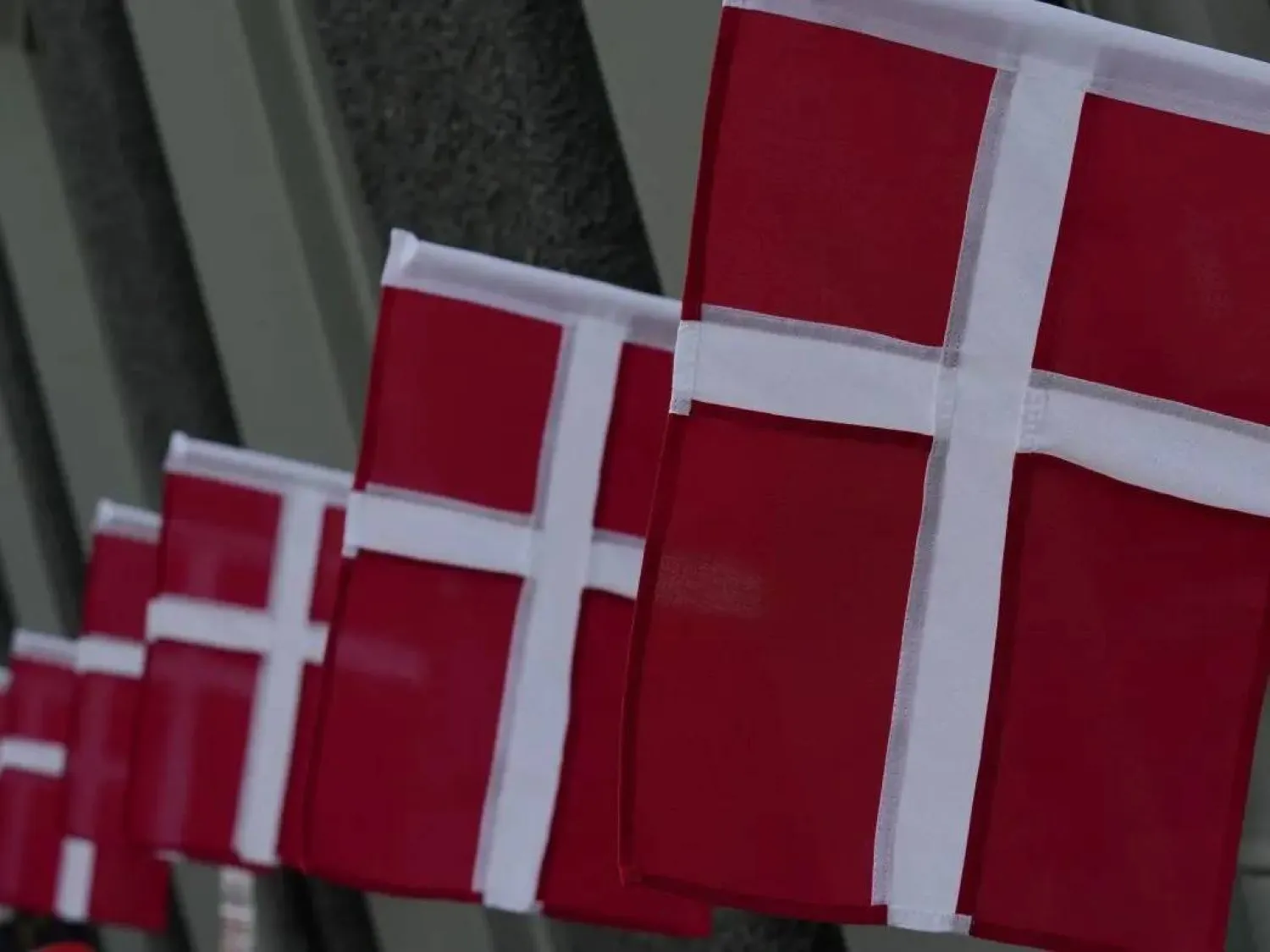 Danish flags flutter in a street in central Copenhagen, Denmark, July 24, 2025. (Reuters)