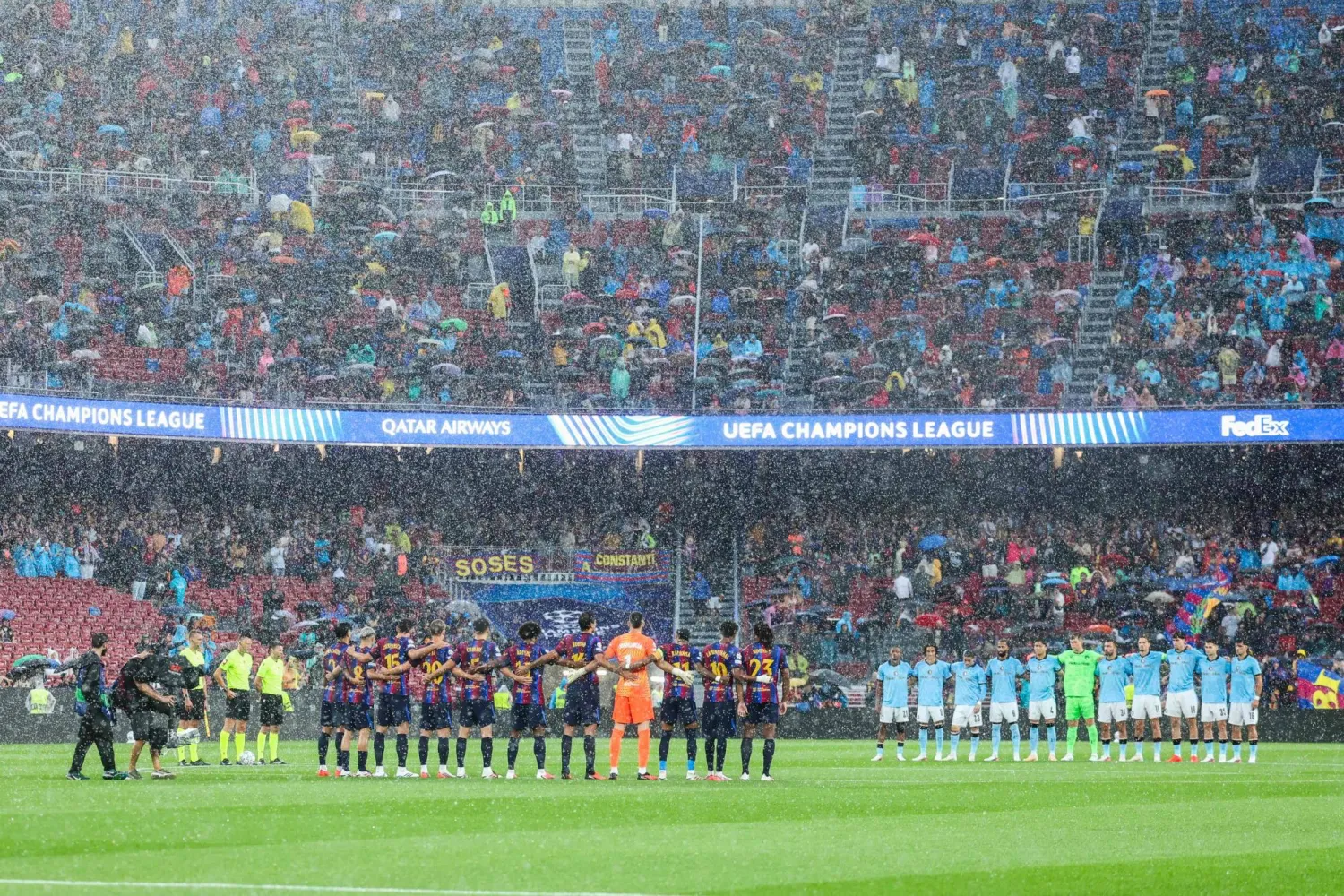  Players observe a minute of silence in remembrance of the victims of the recent devastating floods in Nepal, before the start of the UEFA Champions League first round day 1 football match between FC Barcelona and Feyenoord at Camp Nou stadium in Barcelona on September 9, 2026. (AFP)