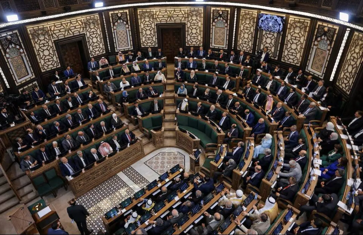 Members of Syria's newly formed People's Assembly attend the body's inaugural session, the first parliament session since the end of the rule of ousted Syrian President Bashar al-Assad, in Damascus, Syria, July 12, 2026. (Reuters)