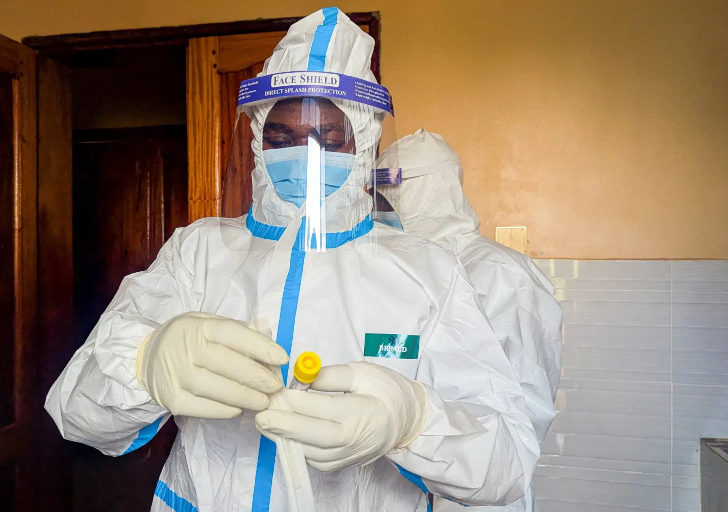 A member of the civil protection team's dignified and safe burial service prepares to swab the body of a child suspected of having died from Ebola at the Butembo Unit Hospital morgue, in Butembo, North Kivu province, Democratic Republic of Congo, September 13, 2026. (Reuters)