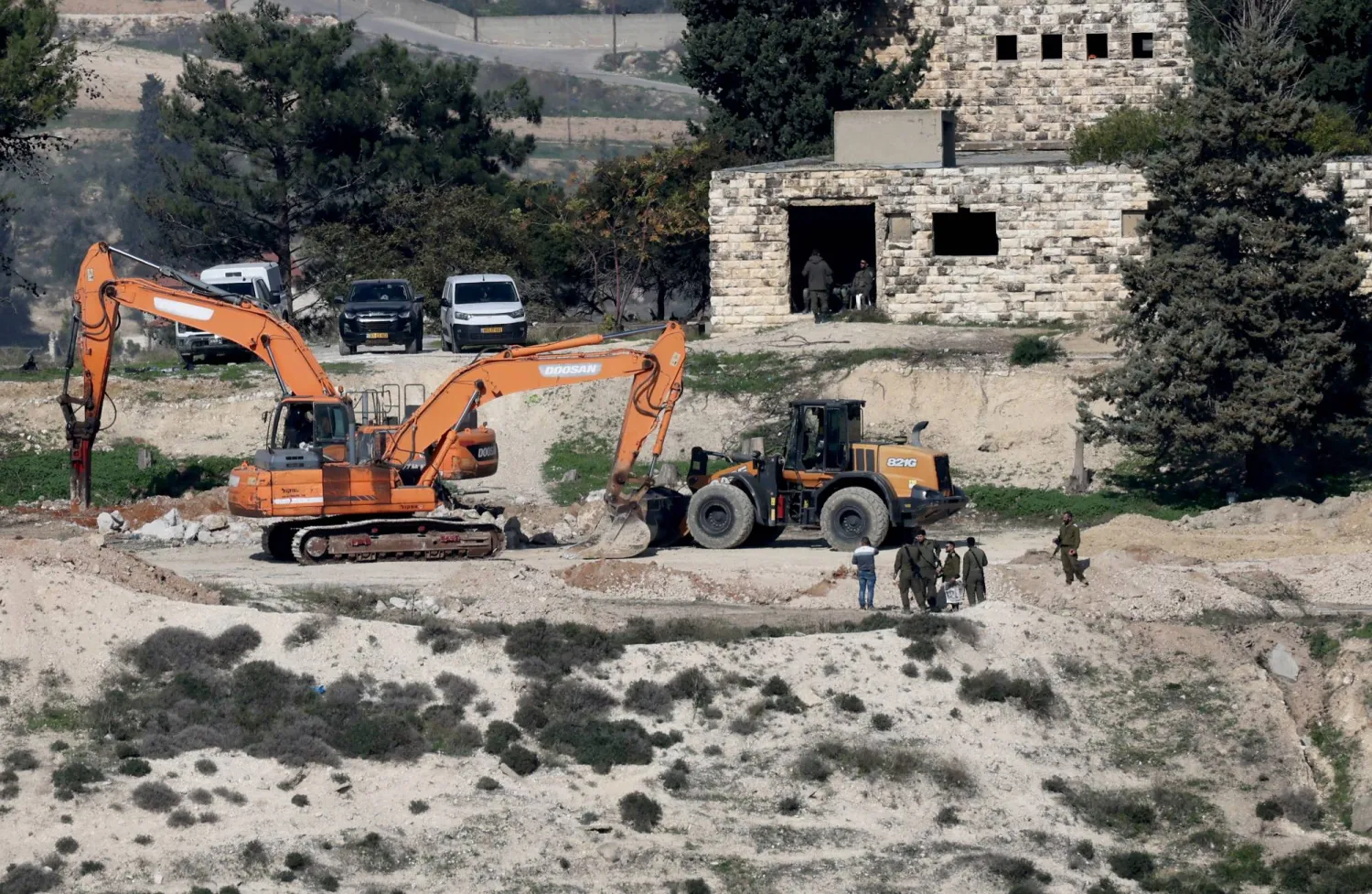 Israeli bulldozers level land at the evacuated Israeli settlement of Sanur, near the West Bank city of Jenin, 23 December 2025. EPA/ALAA BADARNEH