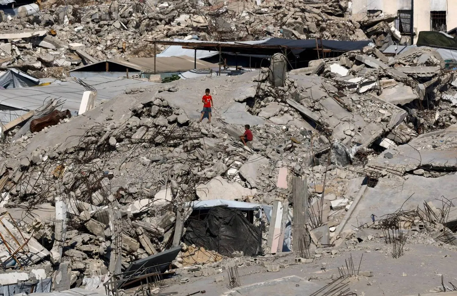 Young Palestinians amid the rubble of buildings destroyed during the war at Jabalia refugee camp in the northern Gaza Strip (File photo: Reuters)