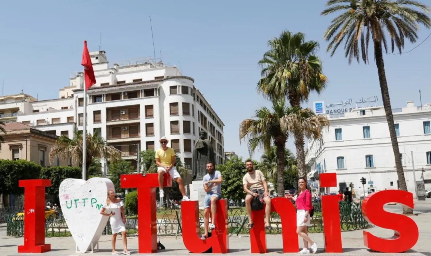 Tourists pose for a picture in downtown Tunis, Tunisia, August 4, 2017. REUTERS/Zoubeir Souissi
