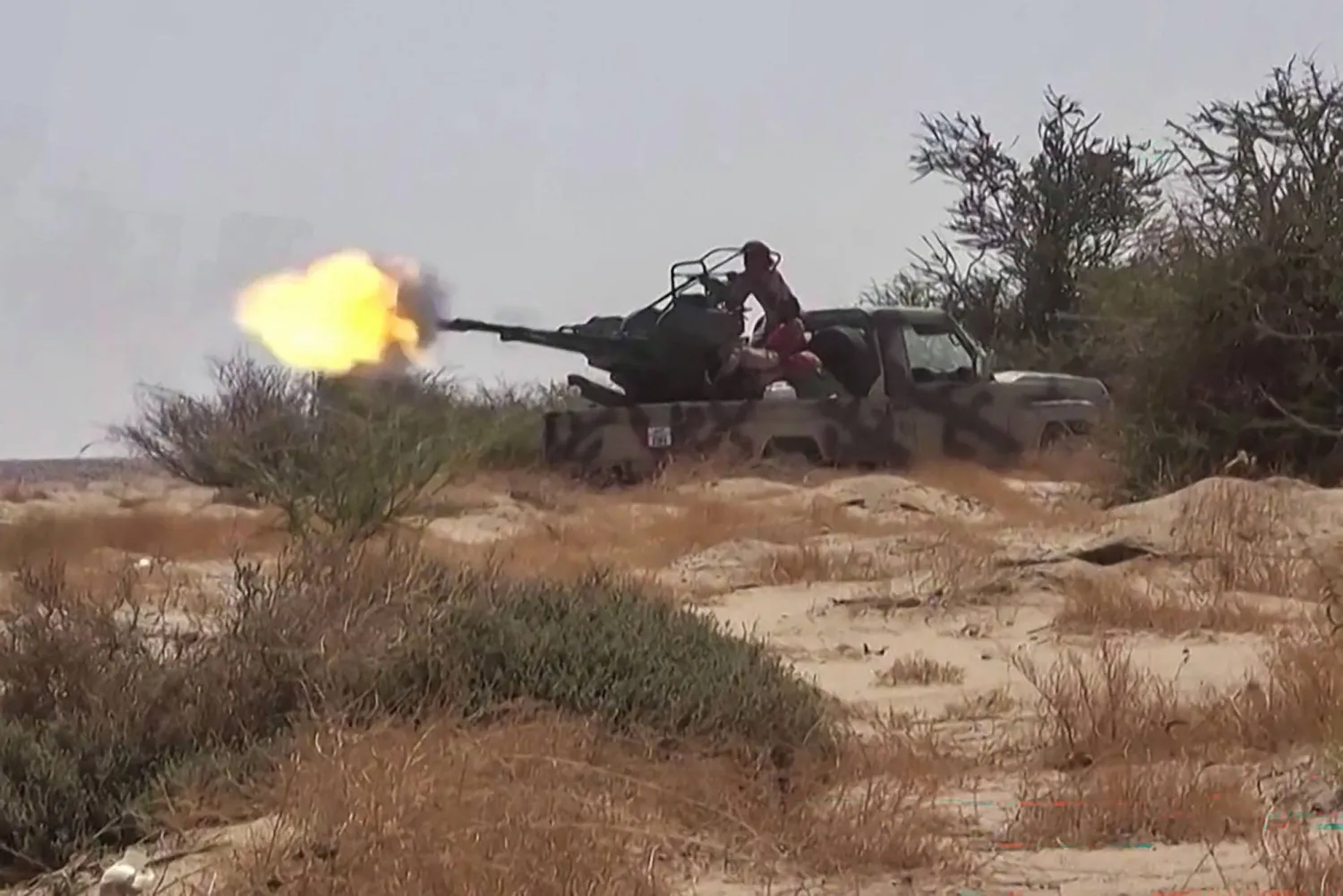 This frame grab taken from AFPTV video footage shows fighters affiliated with the Yemeni government engaging in clashes with Houthi militants in Al-Jawf province on September 15, 2026. (AFPTV / AFP) 
