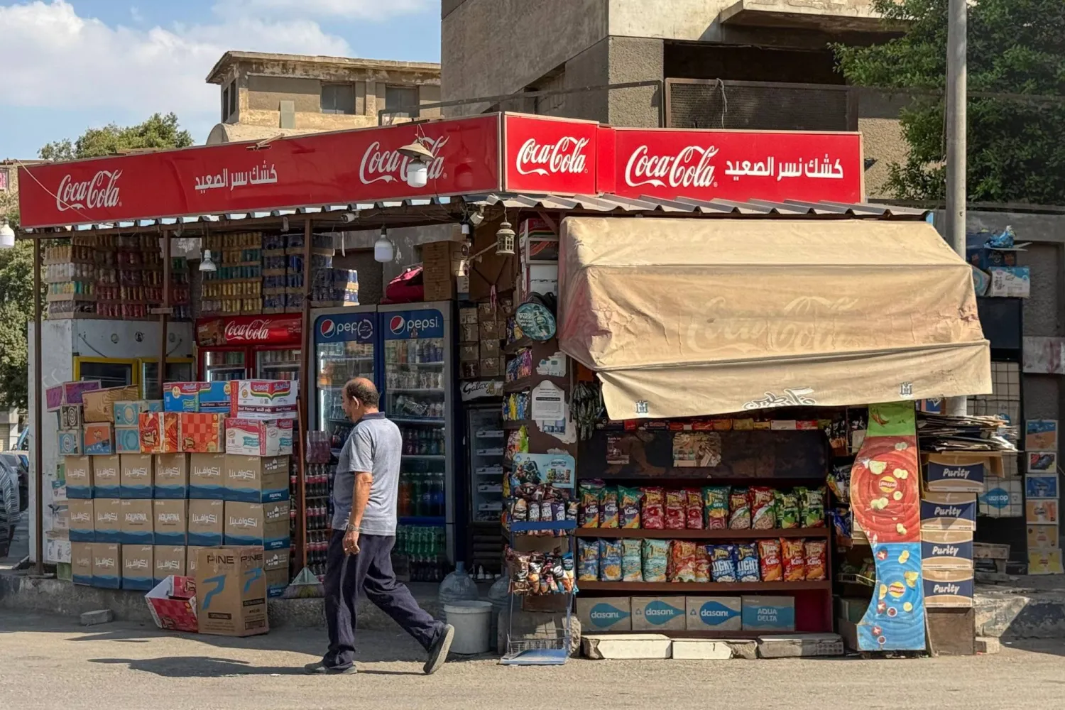 A man walks past a traditional sidewalk kiosk in Cairo on September 18, 2026 (AFP)