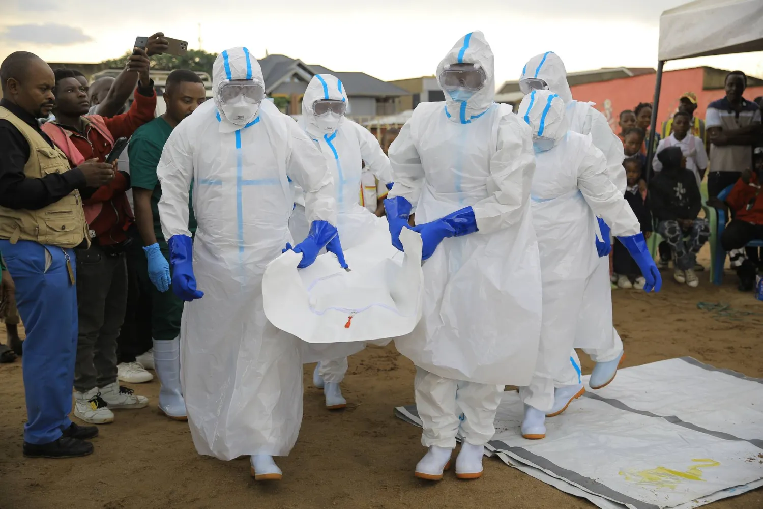 Ebola response teams organize a public demonstration to raise awareness about the Ebola virus disease in Beni, North Kivu province, eastern Congo, Tuesday, Sept. 22, 2026. (AP Photo/Sebastien Kitsa Musayi)