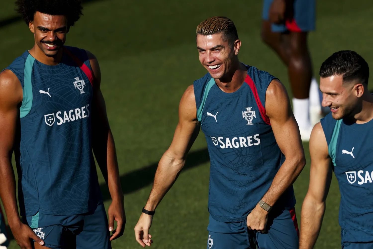 Portugal's Renato Veiga (L), Cristiano Ronaldo and Diogo Dalot (R) during a training session ahead of the UEFA Nations League match against Wales at Cidade do Futebol, Oeiras, Portugal, 23 September 2026. (EPA)