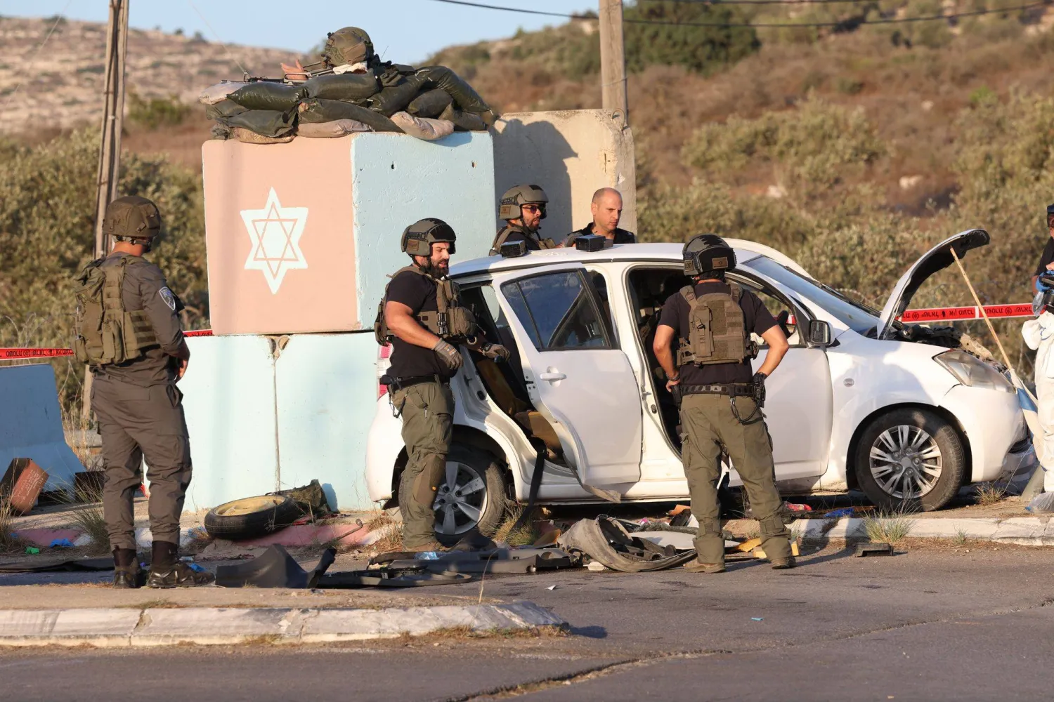 23 September 2026, Beit Horon: Israeli security forces inspect the scene, where a Palestinian man was shot and killed after ramming his car into Maccabim checkpoint and seriously wounding an officer, near the West Bank Jewish settlement of Beit Horon. (dpa) 