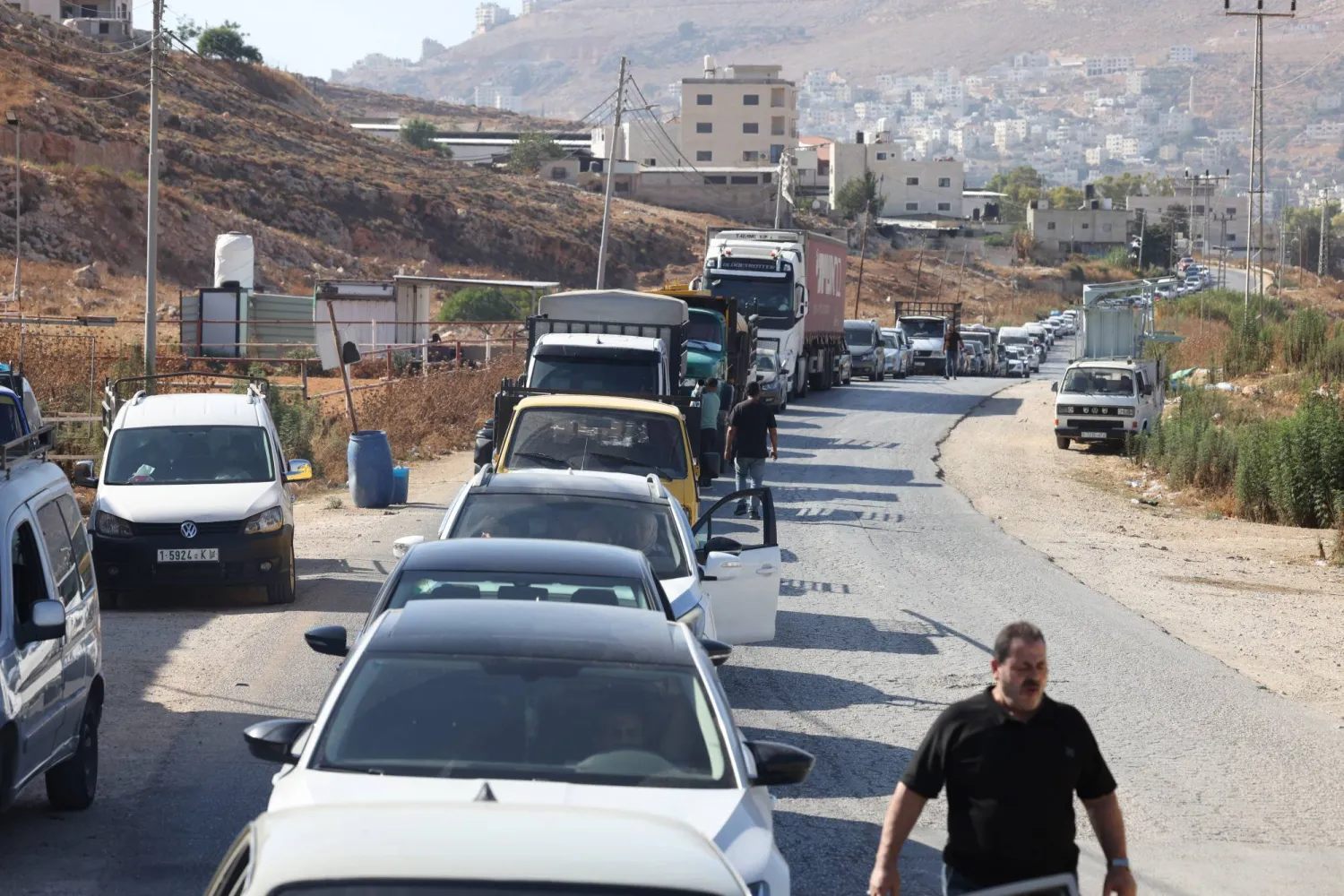 Palestinian motorists wait in line to cross the Beit Furik military checkpoint, east of Nablus, West Bank, 20 September 2026. EPA/ALAA BADARNEH