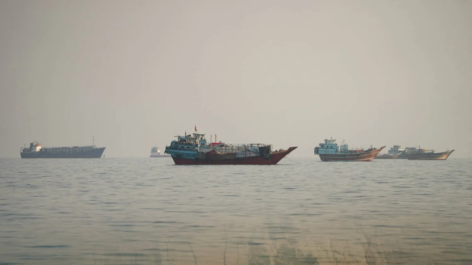 FILE PHOTO: Vessels at the Strait of Hormuz, as seen from Musandam, Oman, September 23, 2026. Picture taken through a window. REUTERS/Stringer/File Photo