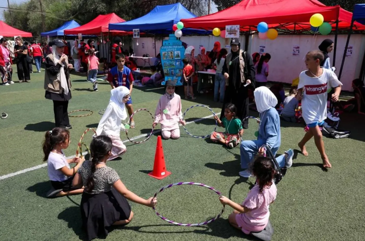 Displaced children play during an activity organized by the NGO Save the Children at a school turned into a shelter for displaced families in Tyre, southern Lebanon, August 27, 2026. (Reuters)
