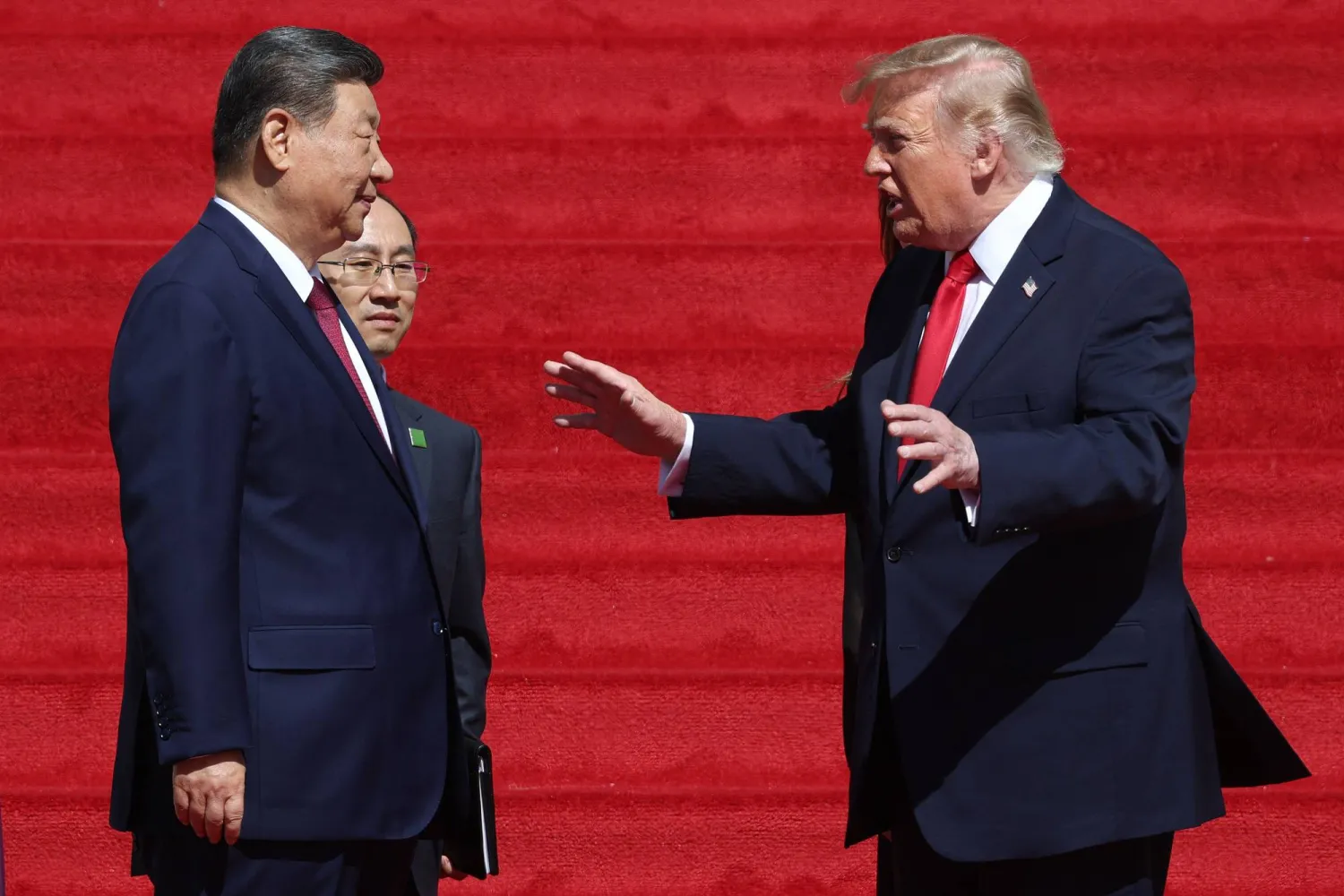 WASHINGTON, DC - SEPTEMBER 25: US President Donald Trump (R) and President of China Xi Jinping (L) speak as they depart following a tour of the National Archives Museum on September 25, 2026 in Washington, DC. Win McNamee/Getty Images/AFP