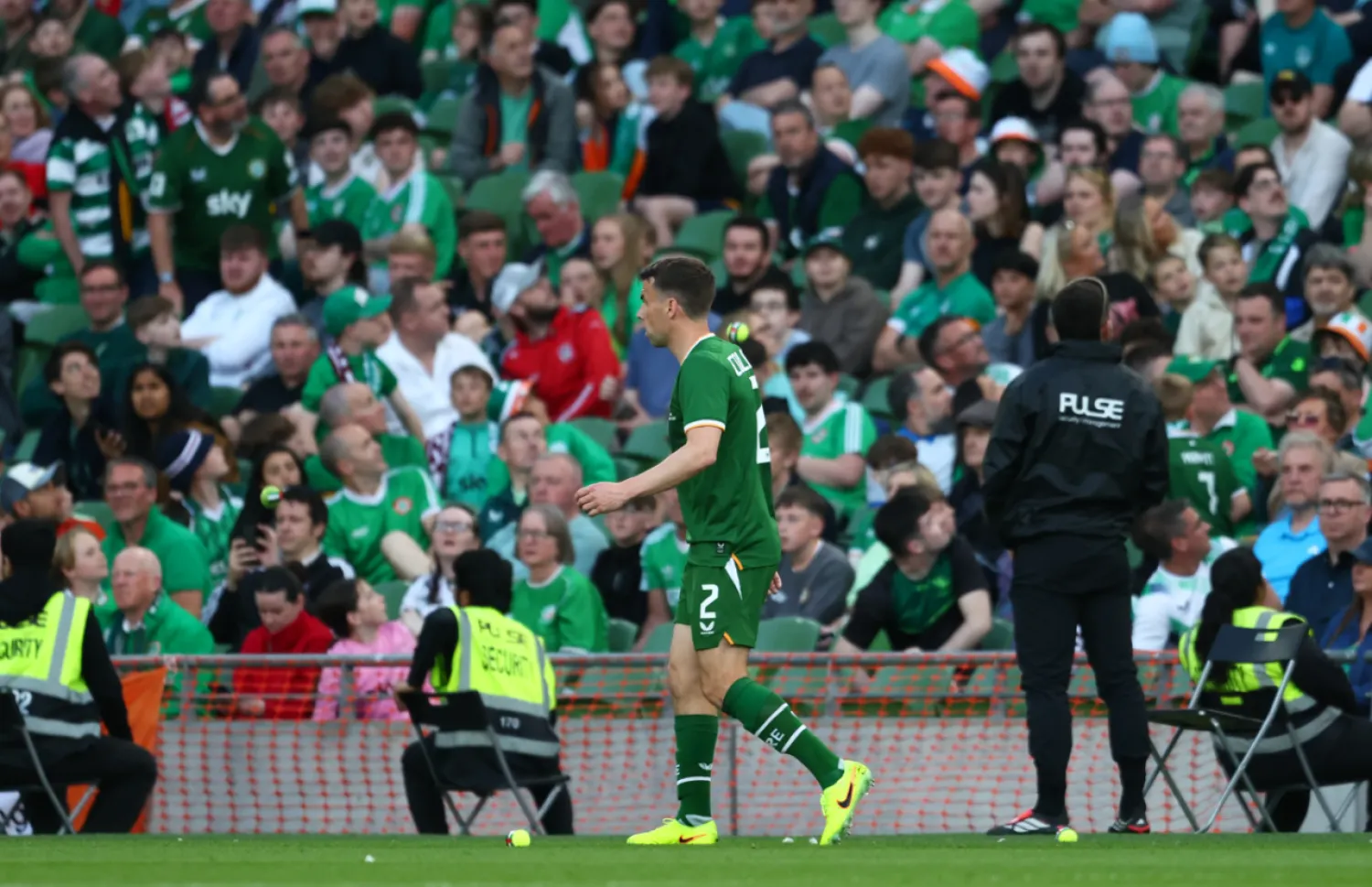 Ireland's Seamus Coleman walks as tennis balls are thrown on to the pitch during the international friendly soccer match between Ireland and Qatar in Dublin, Ireland, Thursday, May 28, 2026. (AP Photo/Peter Morrison) License this photo