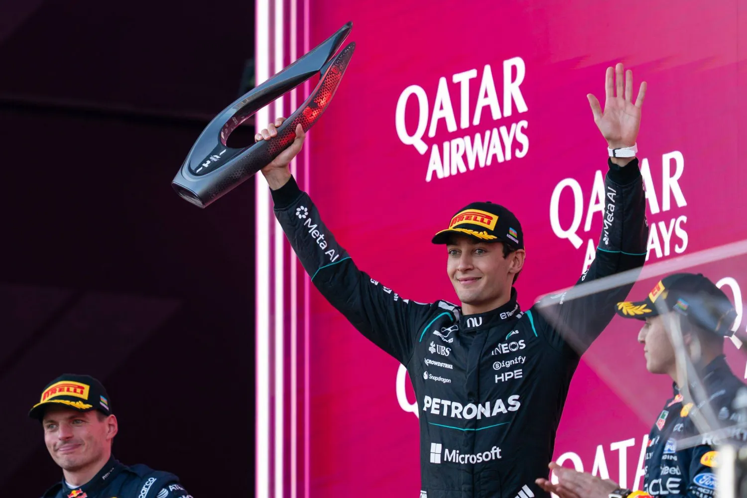 26 September 2026, Azerbaijan, Baku: British formula One driver George Russell of team Mercedes celebrates on the podium after winning the Azerbaijan Formula One Grand Prix at Baku City Circuit. Photo: James Gasperotti/ZUMA Press Wire/dpa