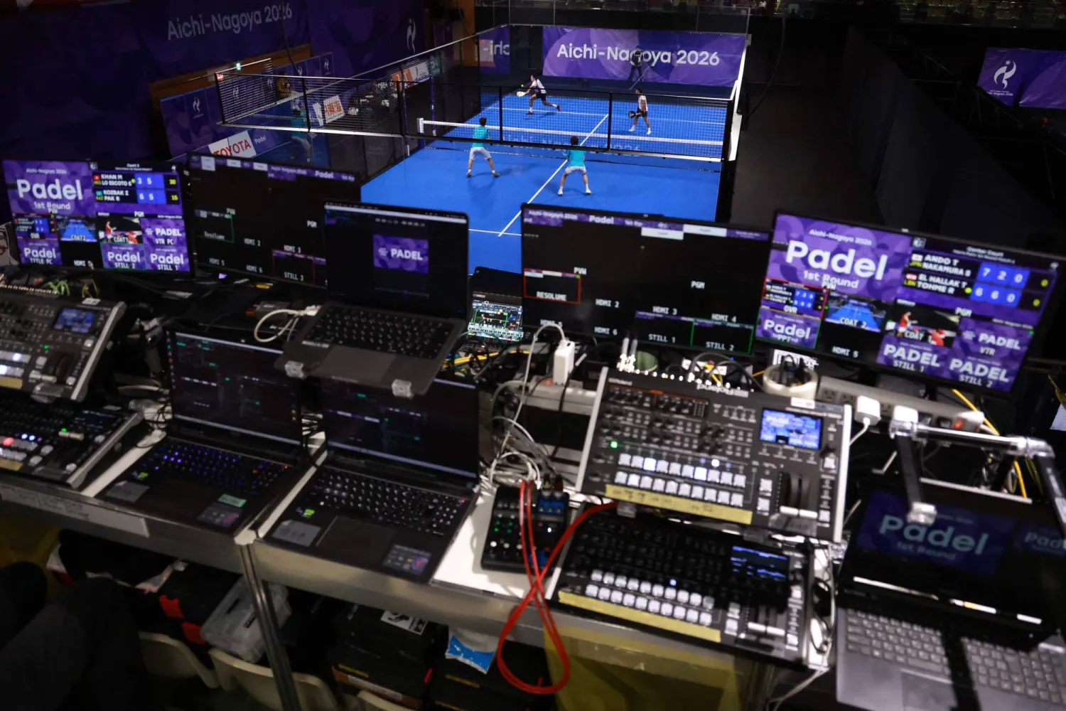 Technical equipment is seen as Hong Kong's Mohammed Khan and Sean Lo Escoto (top) play against Kazakhstan's Zhakas Kozbak and Rodion Pak during the men's pairs padel first round match at the Nagoya City Highashi Sports Center in Nagoya on September 28, 2026. (Photo by DAVID GRAY / AFP)