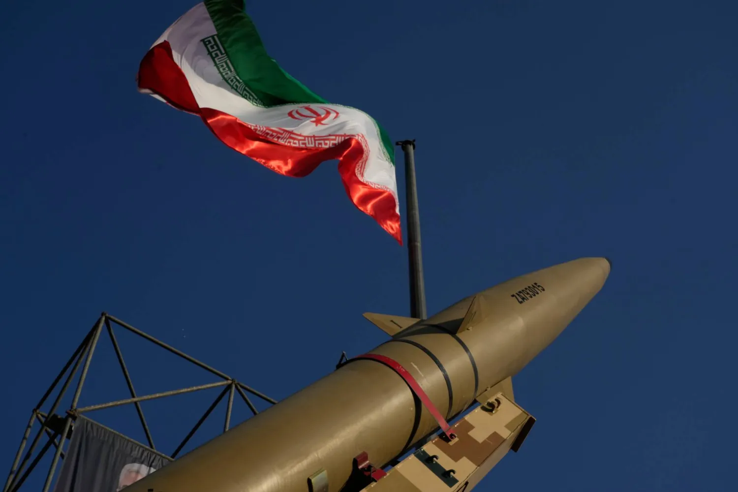  An Iranian missile is displayed under the country's national flag in a military exhibition commemorating the anniversary of the start of the 1980-88 Iraq-Iran war at Baharestan Square, in Tehran, Monday, Sept. 28, 2026. (AP) 