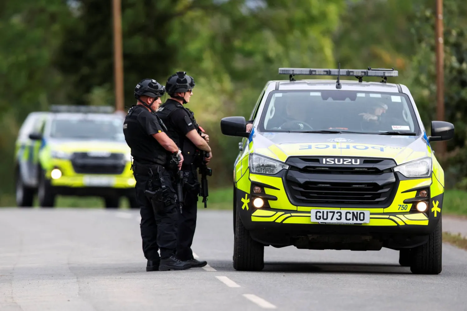 Armed police officers work on a road outside the perimeter of the RAF Fairford airbase, in Fairford, Gloucestershire, Britain, September 28, 2026. REUTERS/Toby Shepheard