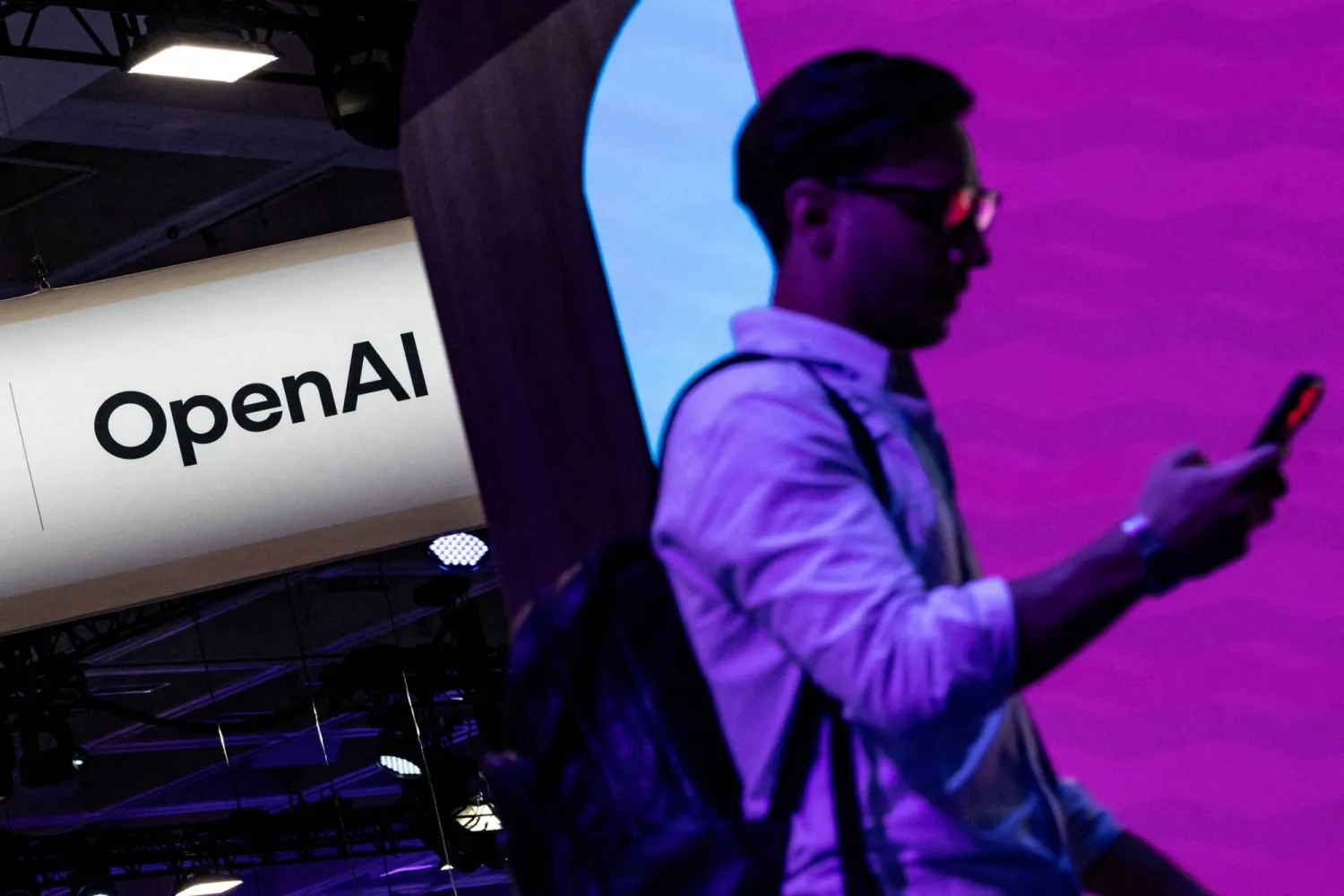 A man walks past an OpenAI booth at Moscone Center during the Dreamforce 2026 technology summit in San Francisco, California, US, September 17, 2026. REUTERS/Carlos Barria