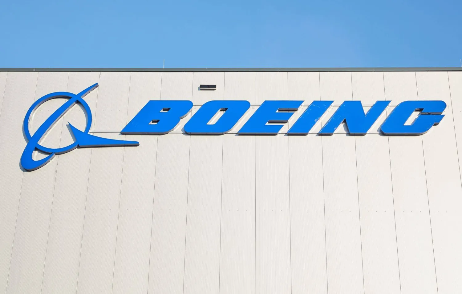 26 October 2022, Schleswig-Holstein, Henstedt-Ulzburg: Boeing logo is pictured on a hall of the US aircraft manufacturer Boeing distribution center in Schleswig-Holstein. (dpa) 