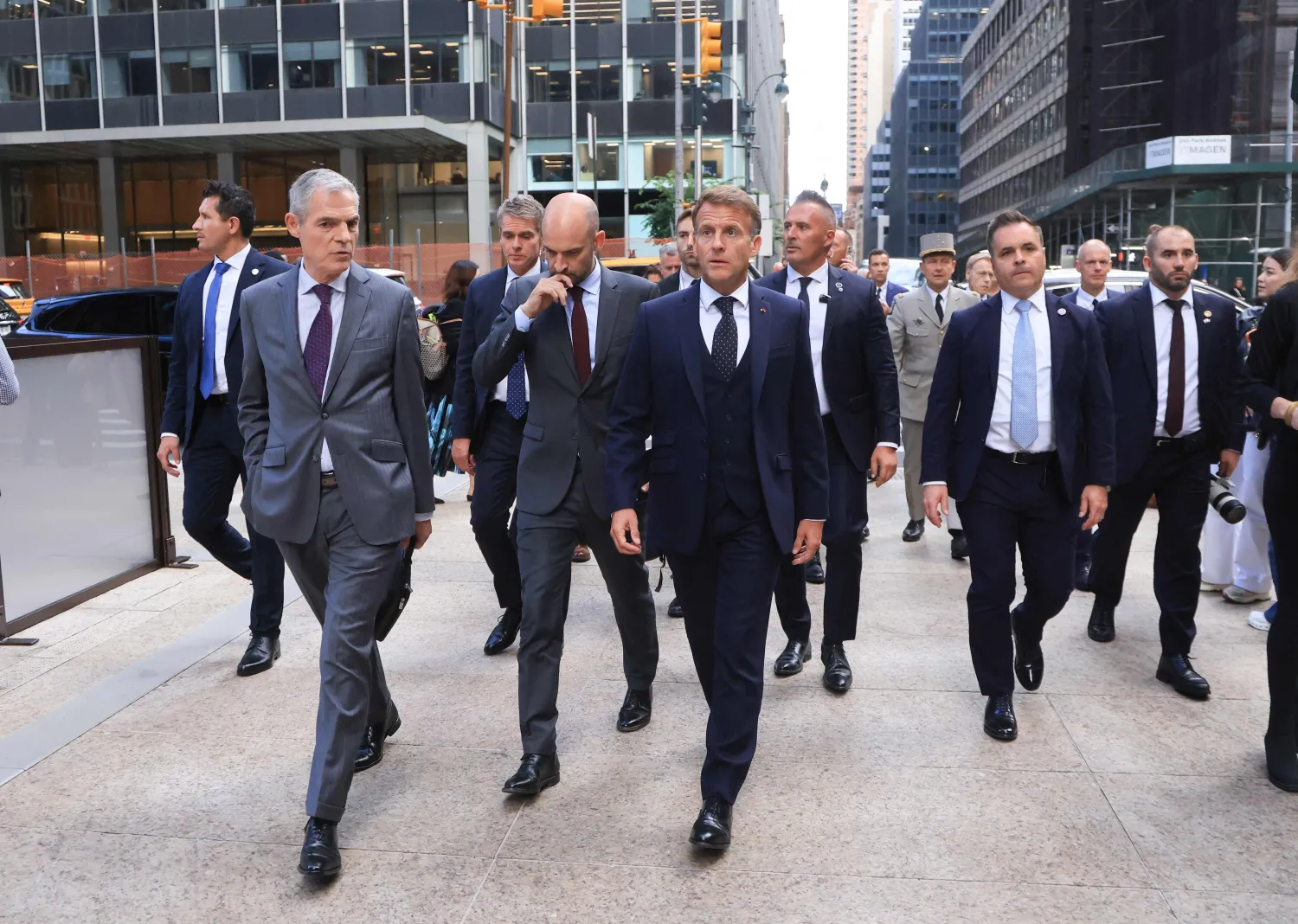 French President Emmanuel Macron (R) walks with Jerome Bonnafont (L), Permanent Representative of France to the United Nations and France’s Foreign Affairs Minister Jean-Noel Barrot (C) as they arrive at Trump Tower in New York City on September 21, 2026, ahead of a meeting with US President Donald Trump. (AFP) 