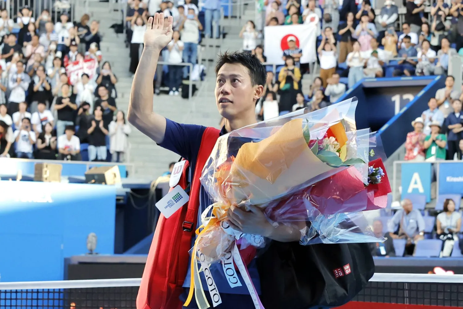 Japan's Kei Nishikori waves to the spectators after his first round loss to Frances Tiafoe at the Japan Open tennis in Tokyo, Thursday, Oct. 1, 2026. (Daiki Katagiri/Kyodo News via AP)