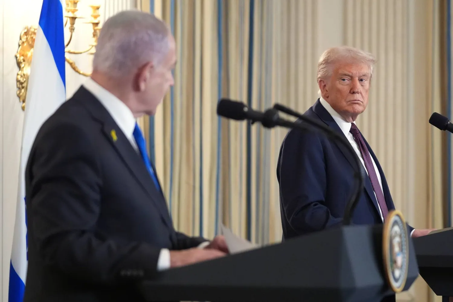 President Donald Trump, right, listens during a news conference with Israeli Prime Minister Benjamin Netanyahu in the State Dining Room of the White House, Sept. 29, 2025, in Washington. (AP)