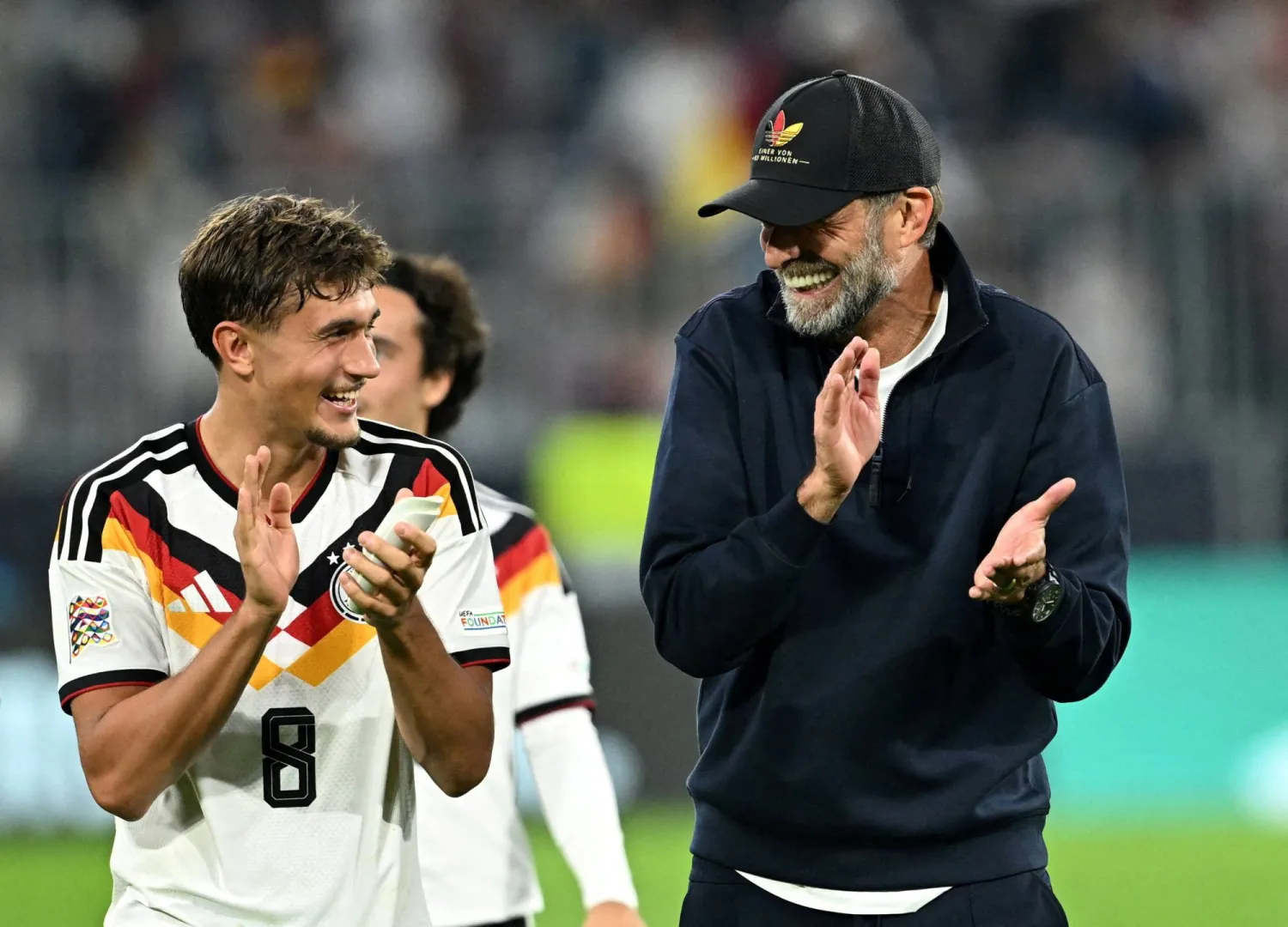 Football - UEFA Nations League - Group A2 - Germany v Serbia - Allianz Arena, Munich, Germany - October 1, 2026 Germany's Tom Bischof and coach Jurgen Klopp applaud fans after the match. (Reuters)