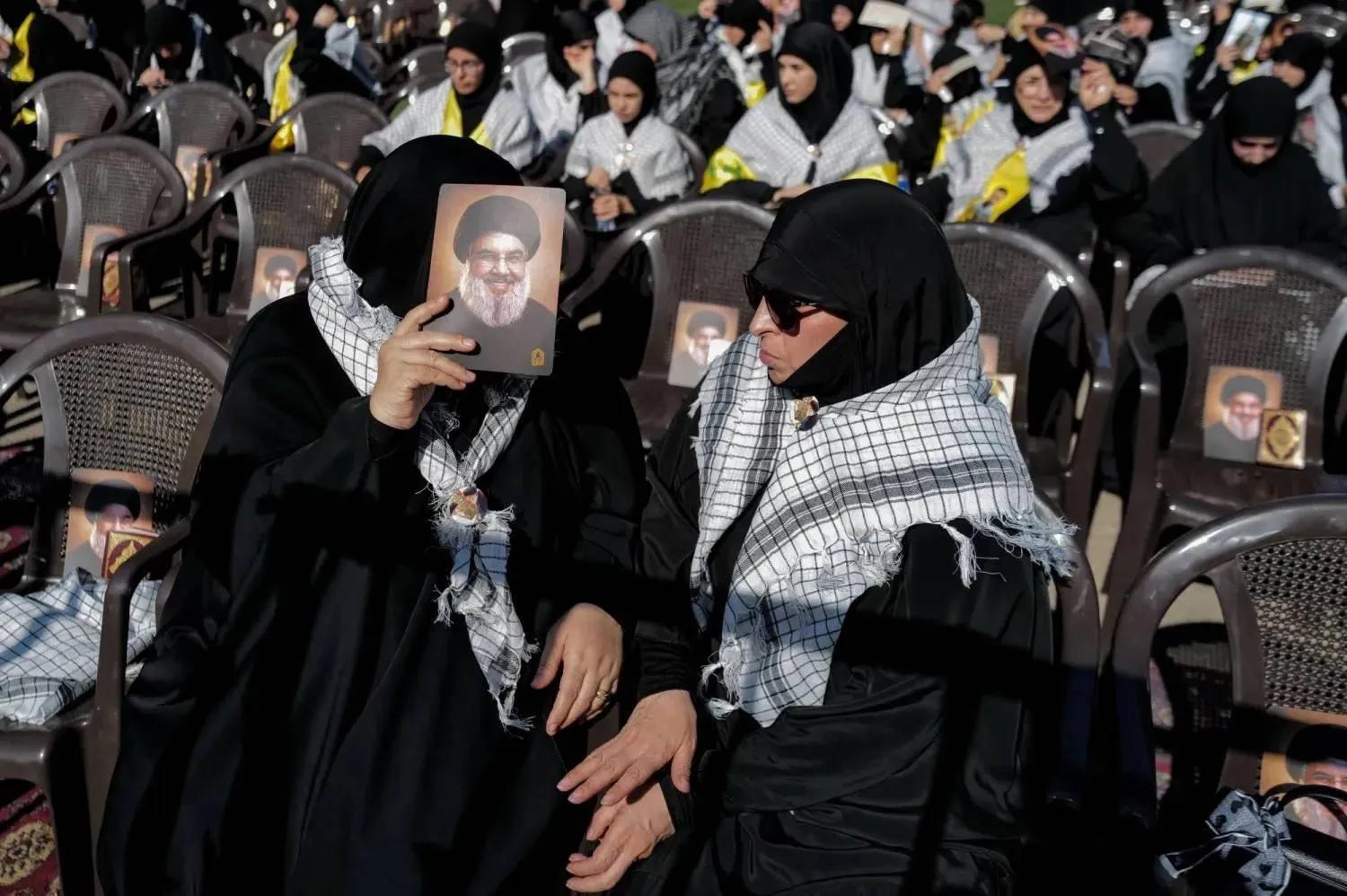 Hezbollah supporters hold a portrait of former Secretary-General Hassan Nasrallah on the second anniversary of his assassination in Beirut’s southern suburbs (Reuters). 