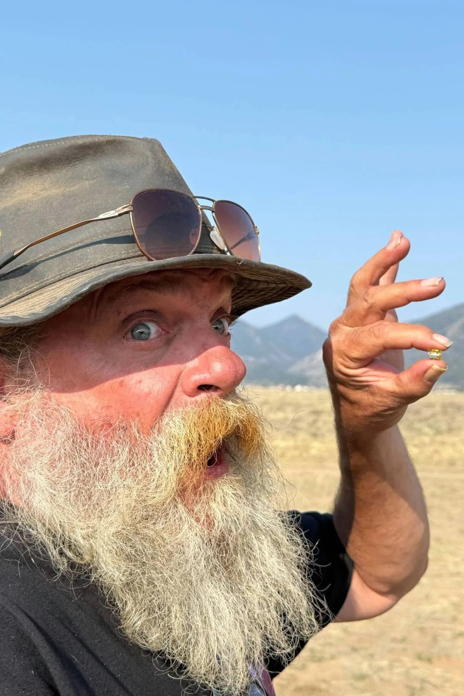 This photo provided by Jack Pearadin shows Brian Busse on Aug. 9, 2026, in Buena Vista, Colo., holding a 6-carat diamond found by Pearadin and Michael Schumacher. (Jack Pearadin via AP)
