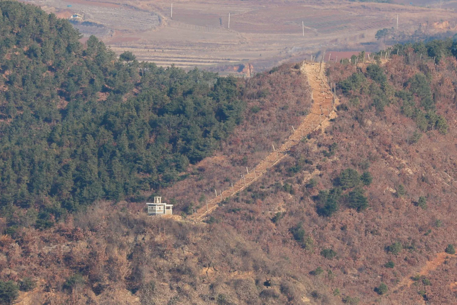 A view shows North Korea's guard post in this picture taken from the top of the Aegibong Peak Observatory, south of the demilitarized zone (DMZ), separating the two Koreas in Gimpo, South Korea, November 29, 2024. REUTERS/Kim Soo-hyeon/File Photo