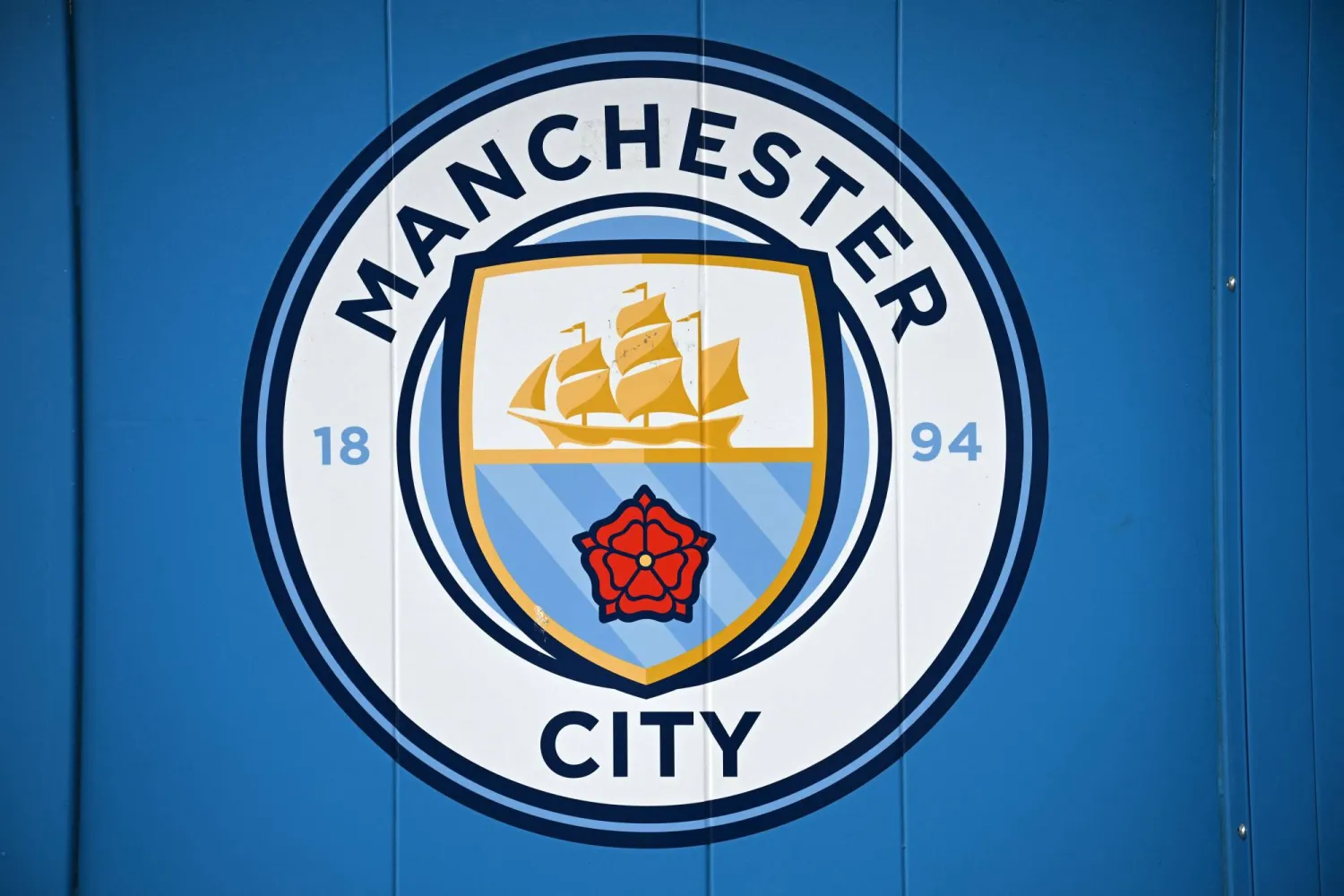 A logo is pictured outside the Etihad Stadium, the home ground of Manchester City football club, in Manchester, north-west England on September 30, 2026. (Photo by Oli SCARFF / AFP)