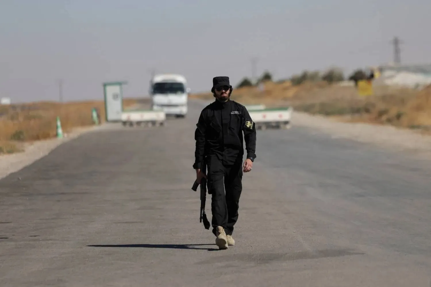 A Syrian Interior Ministry security officer on the outskirts of the village of al-Soura al-Saghira in the Sweida countryside on Sept. 15 (Reuters). 