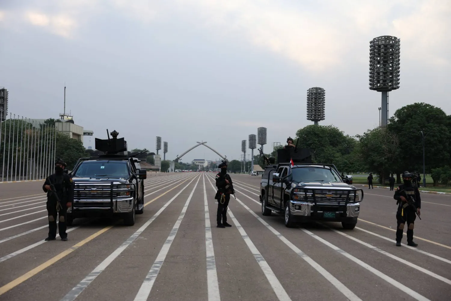 Members of the Iraqi security forces stand guard near the Victory Arch monument during preparations for Sovereignty Day celebrations, marking the withdrawal of US-led coalition forces from Iraq, in Baghdad, Iraq, October 2, 2026. (Reuters)