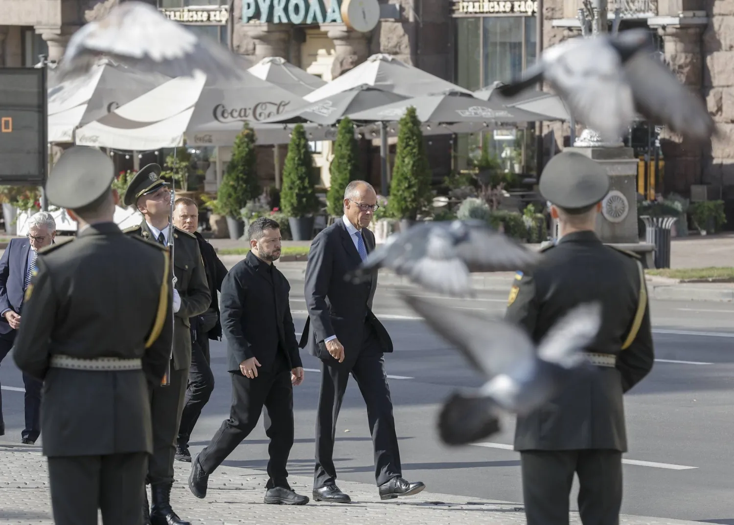 Ukraine's President Volodymyr Zelensky and German Chancellor Friedrich Merz pay tribute at the makeshift memorial to fallen Ukrainian defenders, amid Russia's attack on Ukraine, at the Independence Square in Kyiv, Ukraine, October 4, 2026 (EPA) 