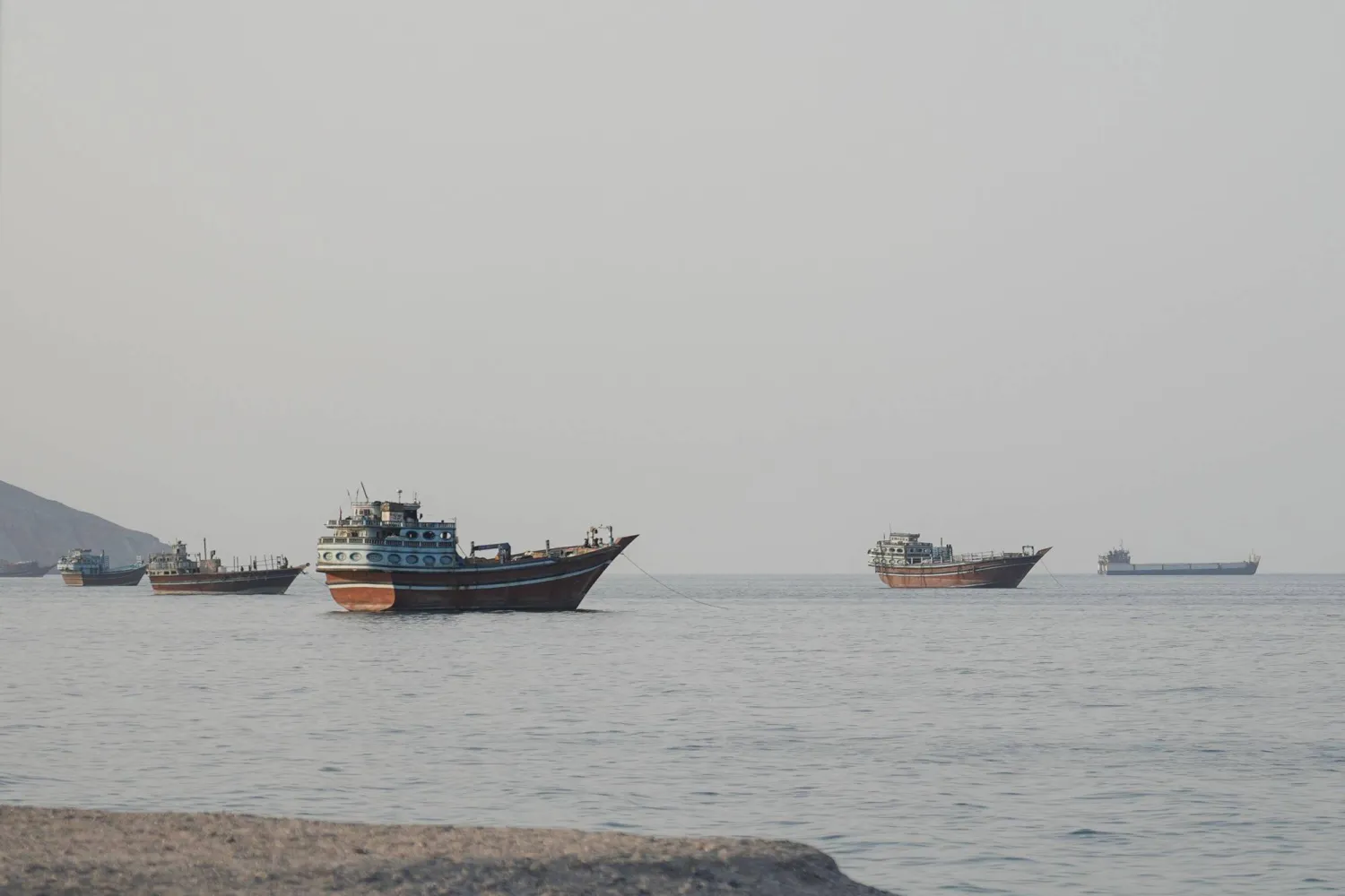 Ships are anchored off the coast of Khasab in Oman's Musandam Governorate, near the Strait of Hormuz, on October 2, 2026. (Photo by AFP)