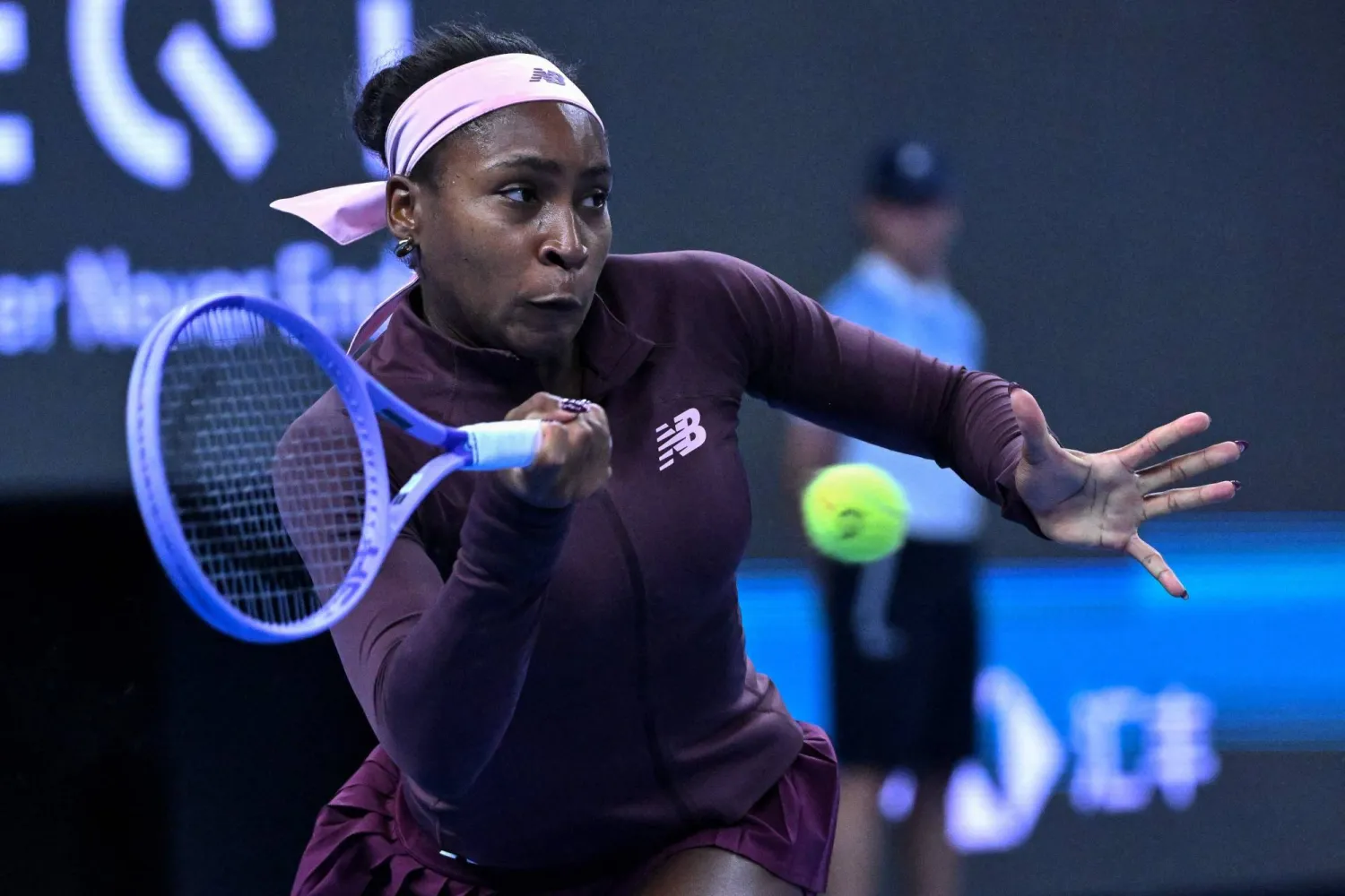 USA's Coco Gauff hits a return to China's Sun Xinran during their women's singles match at the China Open tennis tournament in Beijing on October 5, 2026. (Photo by ADEK BERRY / AFP)