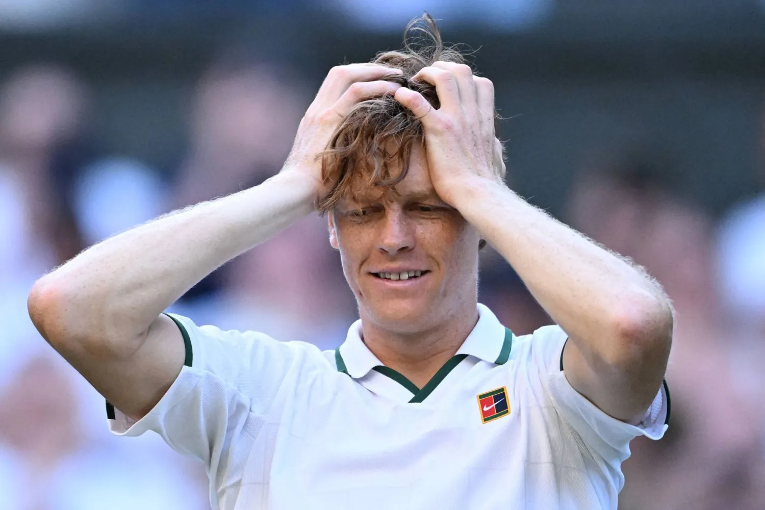 (FILES) Italy's Jannik Sinner reacts to beating Germany's Alexander Zverev during their men's singles final tennis match on the fourteenth day of the 2026 Wimbledon Championships at The All England Lawn Tennis and Croquet Club in Wimbledon, southwest London, on July 12, 2026. (Photo by Kirill KUDRYAVTSEV / AFP)
