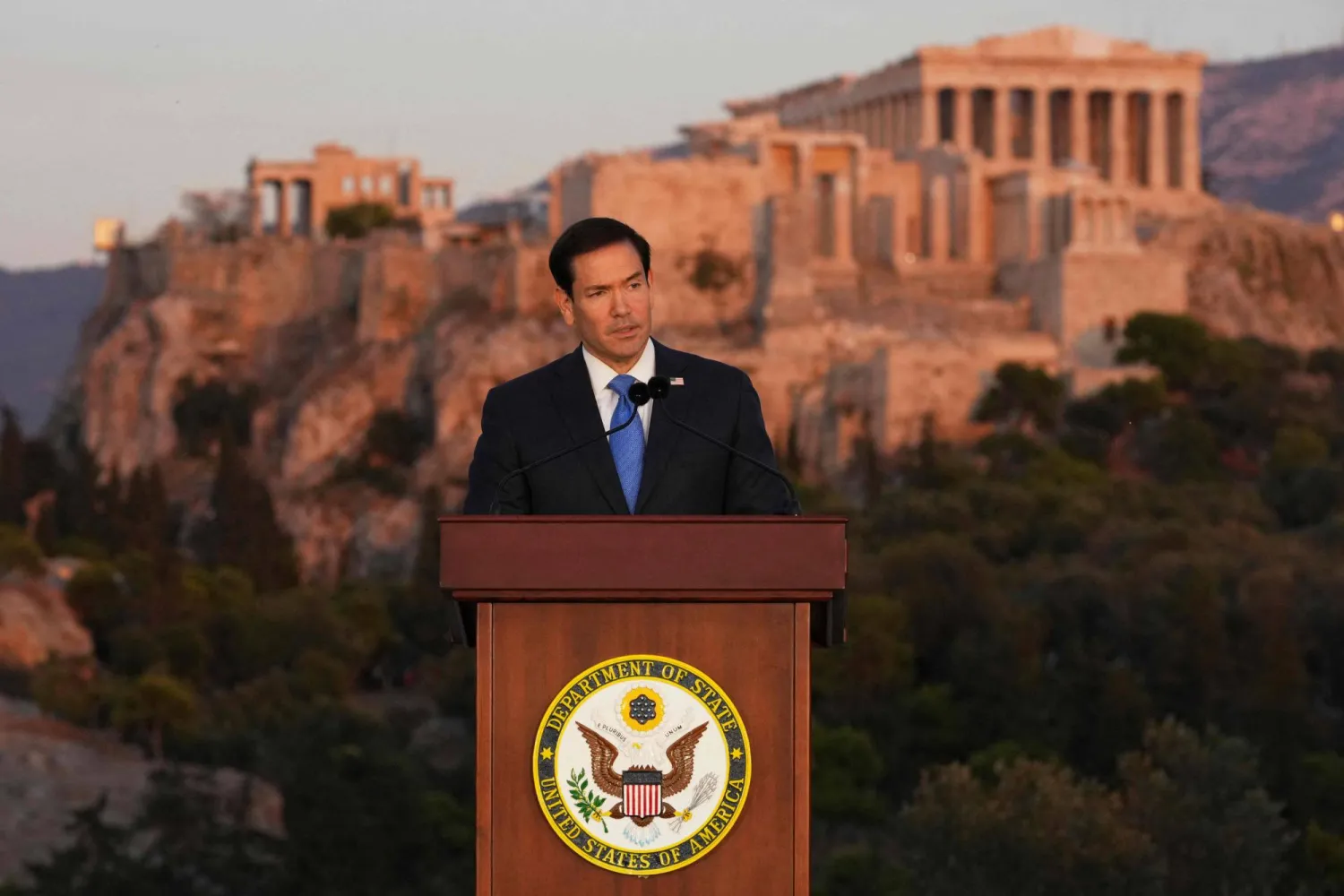 US Secretary of State Marco Rubio speaks at the Pnyx hill, where ancient Athenians held democratic assemblies, with the ancient Parthenon temple atop the Acropolis seen in the background, in Athens,on October 7, 2026. (AFP) 