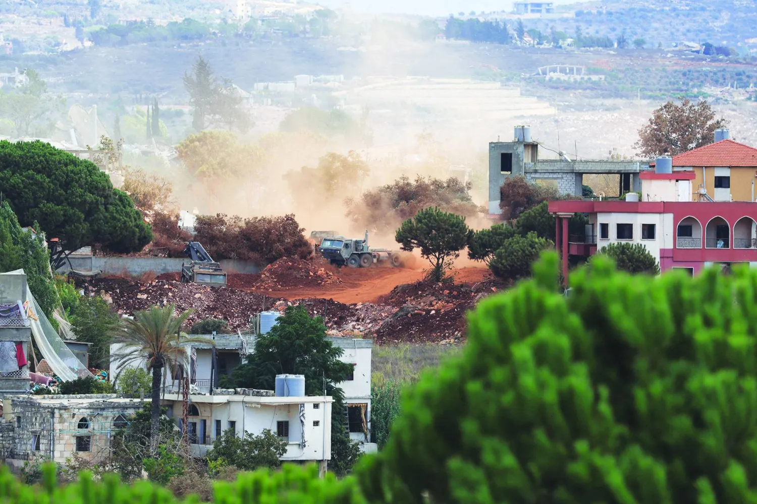 An Israeli army vehicle operates in East Zawtar, as seen from West Zawtar, southern Lebanon, October 1, 2026. REUTERS/Mohamed Azakir