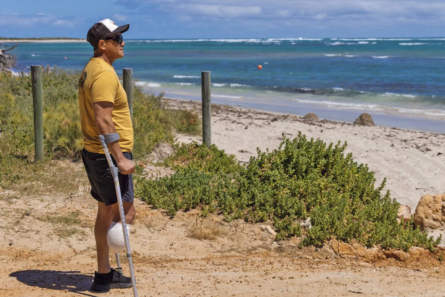 Shark attack survivor Mel Ismail looks out at Glenfield Beach near Geraldton, Australia, on Oct. 7, 2026. (Chris Lewis/Australian Broadcasting Corp via AP)