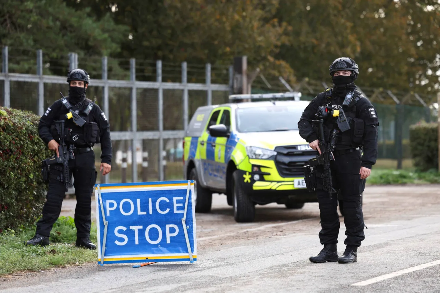 FILE PHOTO: Armed police officers stand guard on a road outside the perimeter of the RAF Fairford airbase, in Fairford, Gloucestershire, Britain, September 28, 2026. REUTERS/Toby Shepheard/File Photo