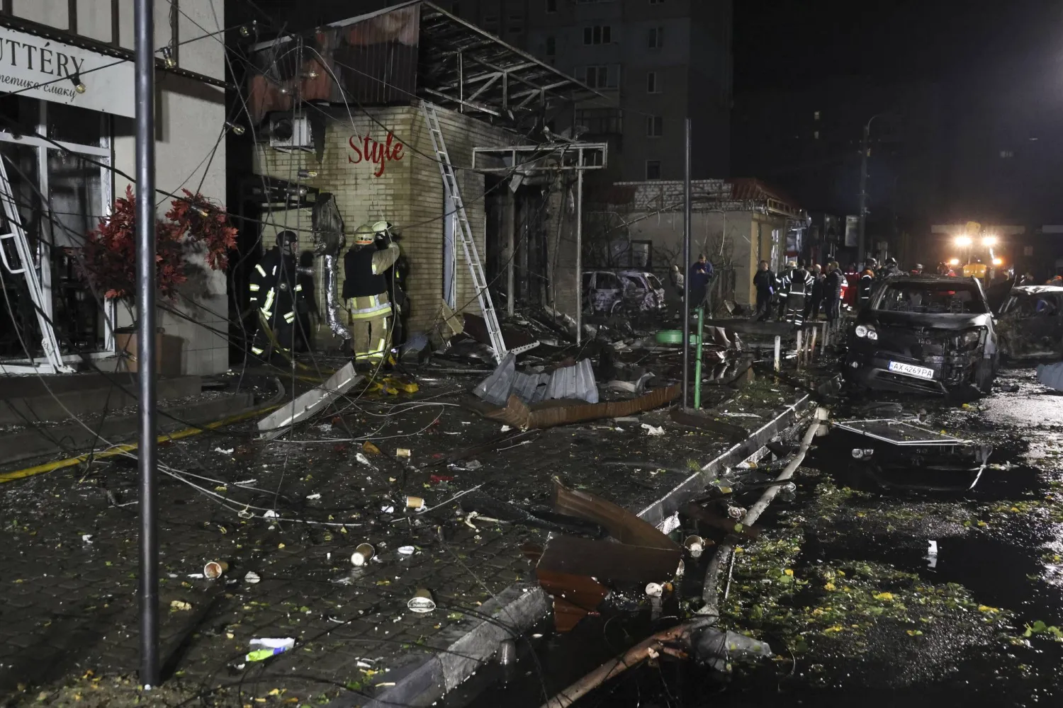 Ukrainian rescuers work at the site of a Russian missile strike on a shop in a residential area in the city of Pisochyn in Kharkiv area, northeastern Ukraine, 11 October 2026. (EPA)