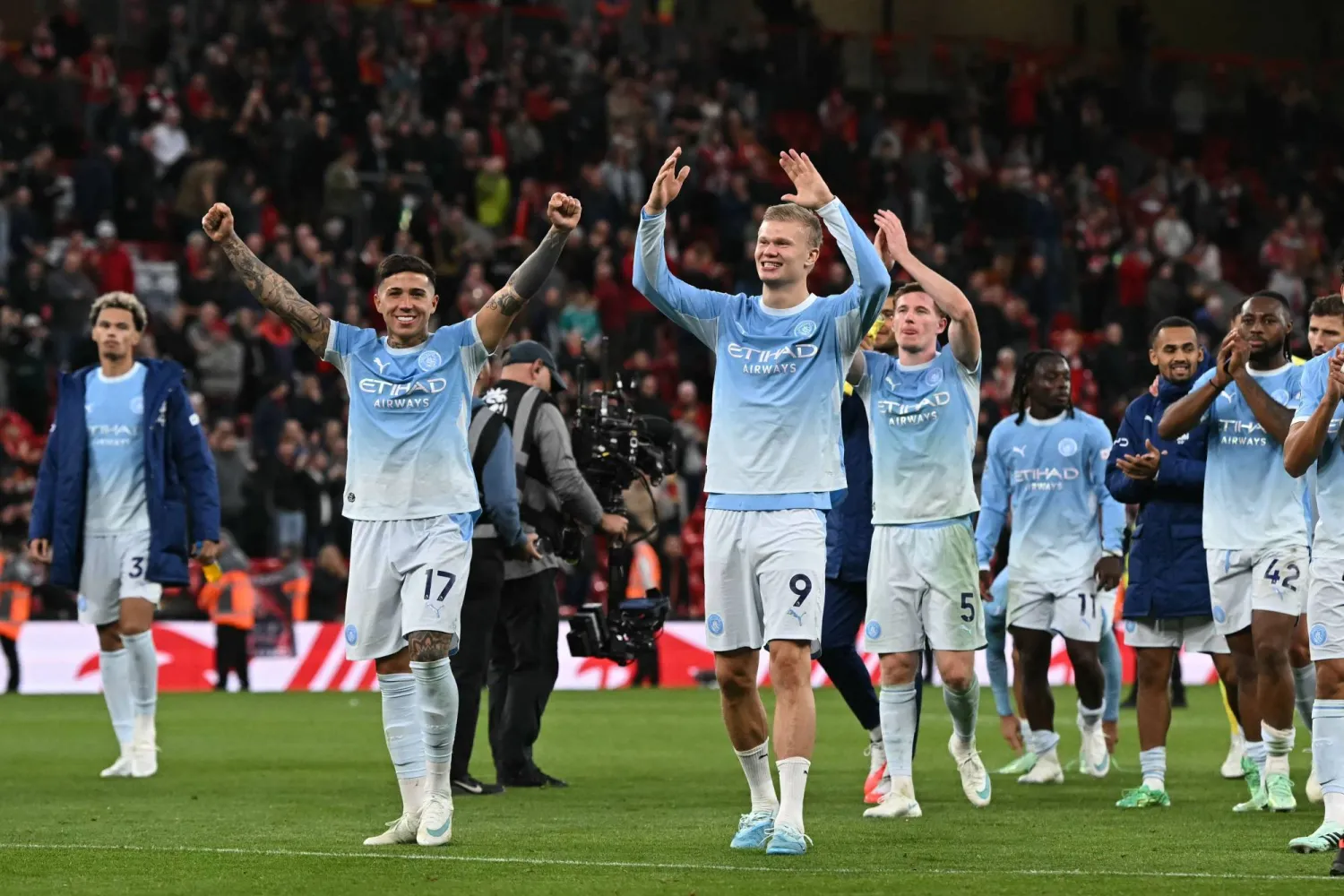 Manchester City's players celebrate on the pitch after the English Premier League football match between Liverpool and Manchester City at Anfield in Liverpool, northwest England on October 11, 2026. (AFP)