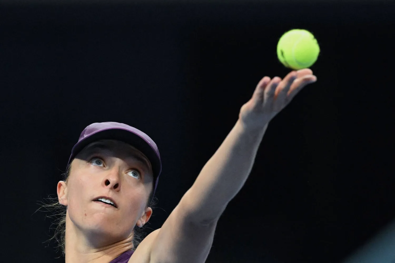 Poland's Iga Swiatek serves to Belgium's Elise Mertens during their women's singles quarter-final match at the China Open tennis tournament in Beijing on October 9, 2026. (Photo by Greg Baker / AFP)