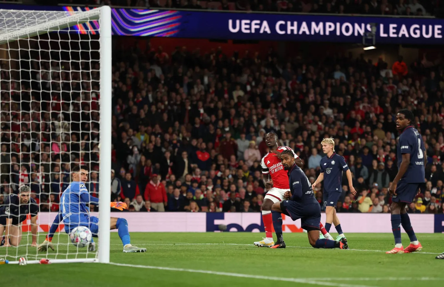 Arsenal's English midfielder #07 Bukayo Saka scores the team's third goal during the UEFA Champions League, league phase football match between Arsenal and Lille at the Emirates Stadium in north London on October 13, 2026. (AFP)