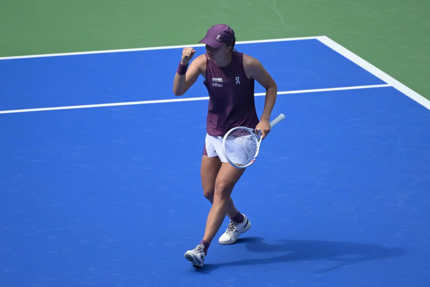 Poland's Iga Swiatek reacts after a point against Poland's Magdalena Frech during their women's singles match at the Wuhan Open tennis tournament in Wuhan, China's Hubei province on October 14, 2026. (Photo by WANG Zhao / AFP)