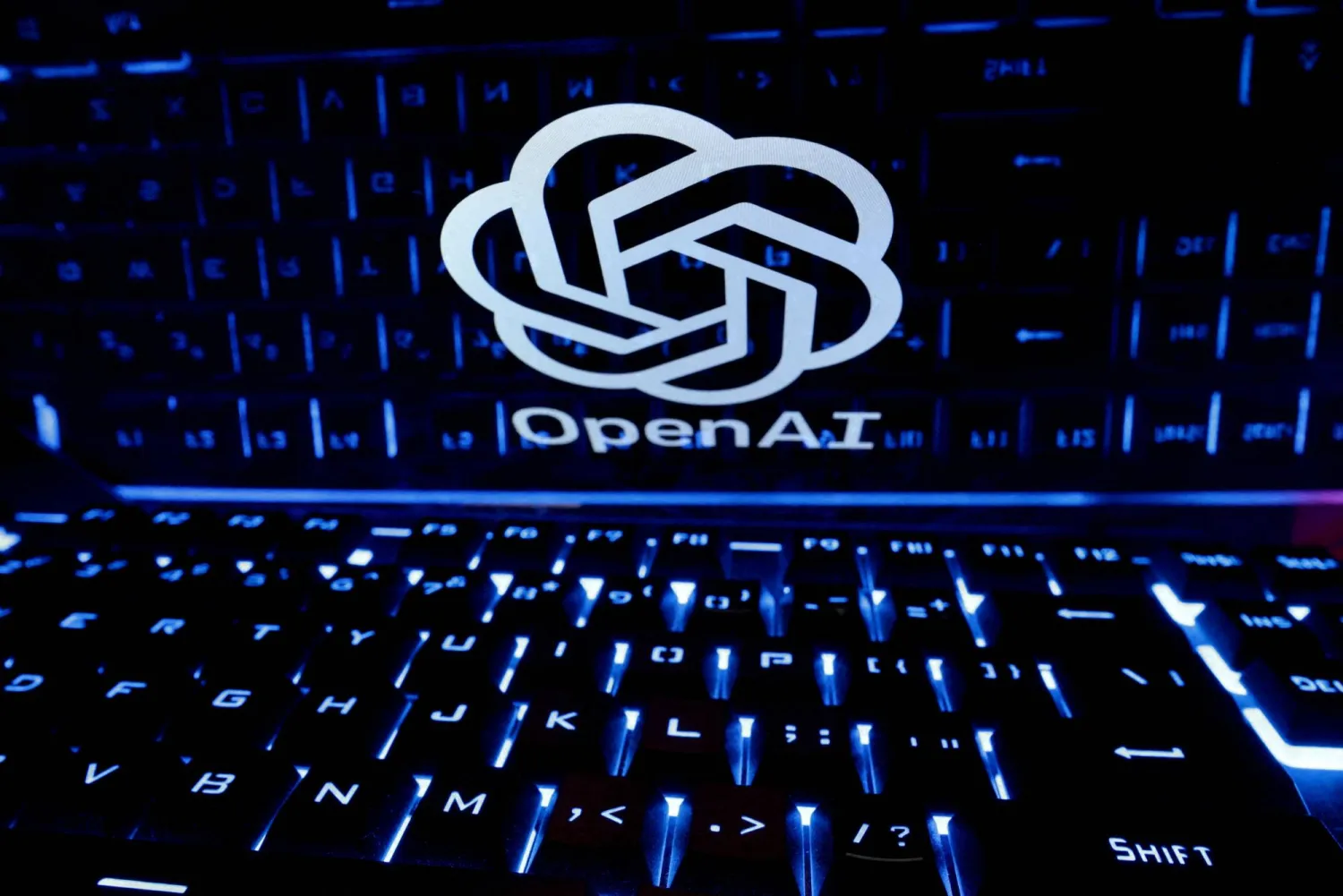 A keyboard is placed in front of a displayed OpenAI logo in this illustration taken February 21, 2023. (Reuters)