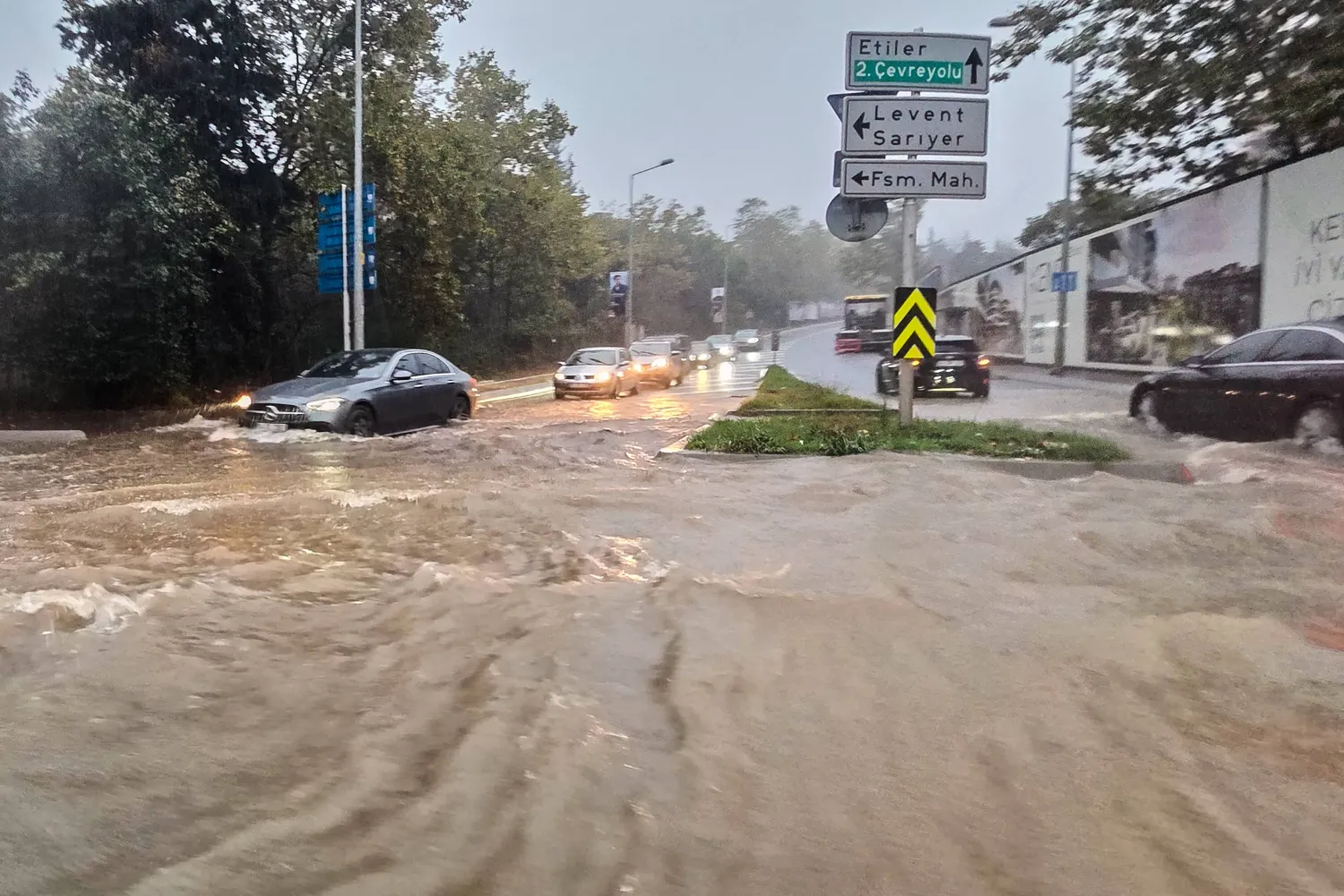 Vehicles drive along a partially flooded road during a heavy rain in Istanbul, Türkiye, Wednesday, Oct. 14, 2026. (Omer Hamza Yildiz/DIA Photo via AP) 